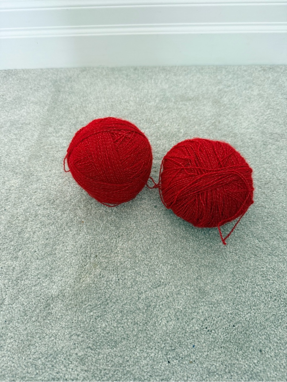 2 balls of red yarn